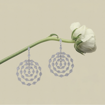 Phoenix plume earrings with white flower