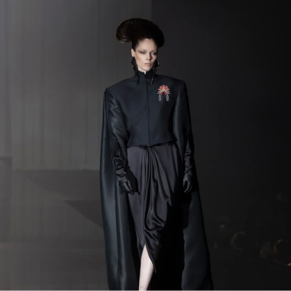 Model wearing a Chinese opera mask brooch